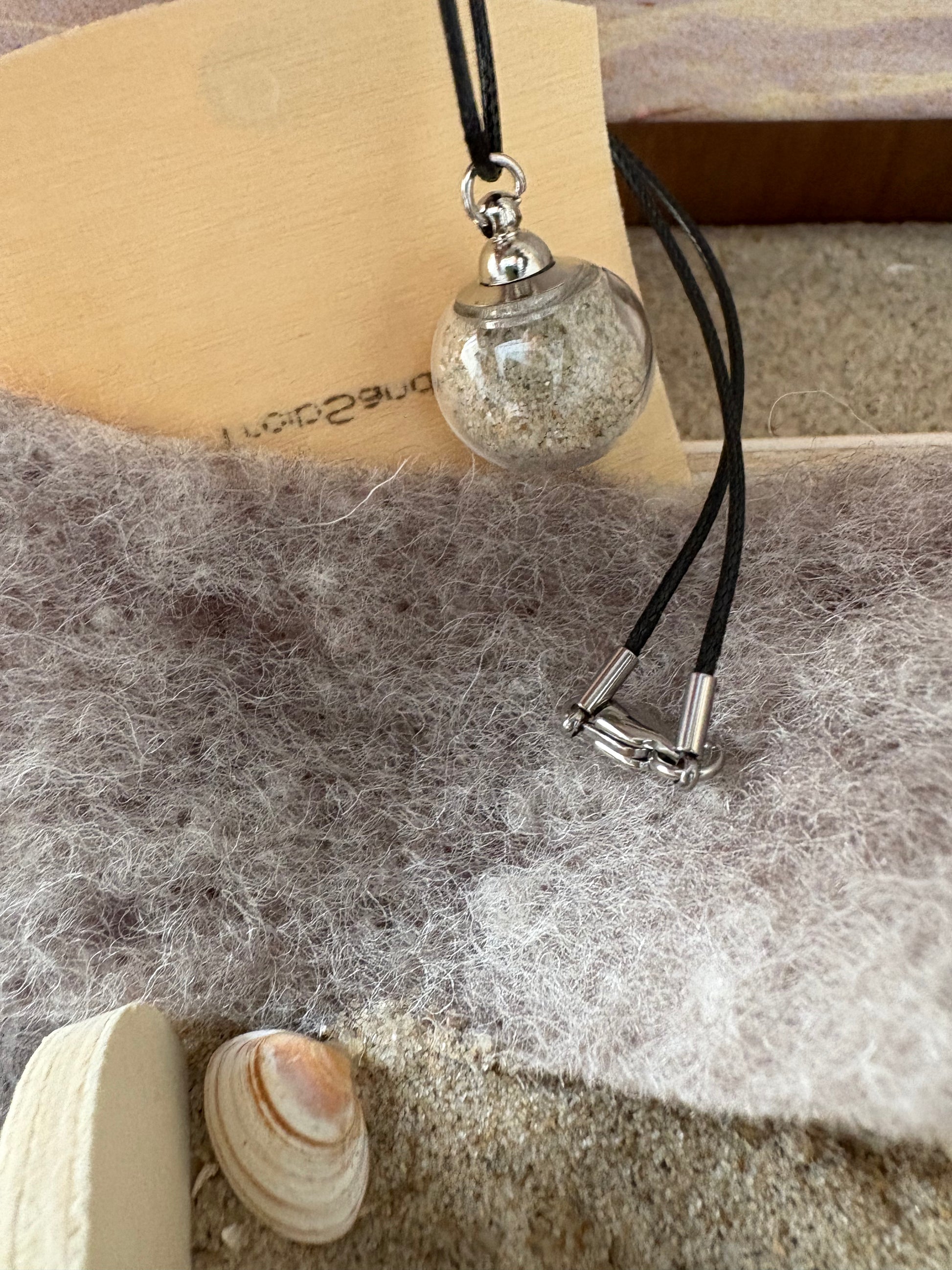 Glasperle mit Sand TreibSand